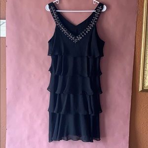Woman’s black layered dress